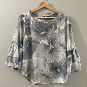 Ann Taylor LOFT. White and blue floral top with ruffle Bell sleeves. Size XSP